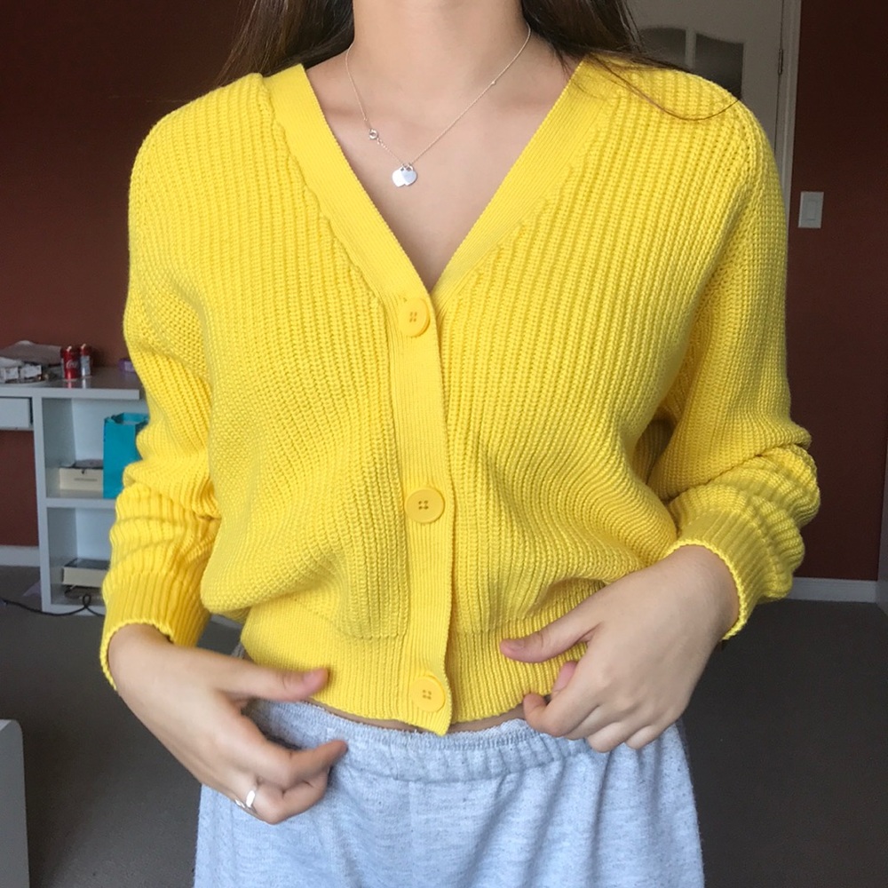 A yellow button-up cardigan from Jennyfer